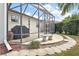 Enjoy this screened patio with flagstone flooring and walkway at 17640 Se 81St Timberwood Ter, The Villages, FL 32162