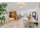 Open concept kitchen with island seating, adjacent dining area with round table at 2001 Castano Pl, The Villages, FL 32159