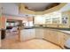 Spacious kitchen featuring ample cabinetry, Corian countertops, and a gas cooktop at 21737 Royal St Georges Ln, Leesburg, FL 34748