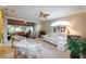 Bright and airy living room with comfy seating and access to the sunroom at 21737 Royal St Georges Ln, Leesburg, FL 34748