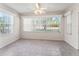 Sunroom with tile floors and multiple windows at 2238 Margarita Dr, The Villages, FL 32159