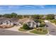 Aerial view of single-Gathering home with landscaped yard and screened patio at 2243 Montbrook Pl, The Villages, FL 32162