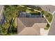 Top-down view of a home's roof, showing a screened patio in the backyard at 2243 Montbrook Pl, The Villages, FL 32162