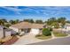 Single-story home with landscaped yard and driveway at 2243 Montbrook Pl, The Villages, FL 32162
