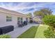Landscaped backyard with patio, grill, and plenty of space at 2243 Montbrook Pl, The Villages, FL 32162