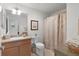 Bathroom with shower/tub combo and updated vanity at 2243 Montbrook Pl, The Villages, FL 32162