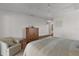 Bedroom with wood furniture and access to en-suite bathroom at 2243 Montbrook Pl, The Villages, FL 32162