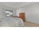 Bright bedroom with sliding glass doors opening to backyard at 2243 Montbrook Pl, The Villages, FL 32162