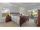 Spacious Primary bedroom with large window and sliding glass doors leading to the patio at 2243 Montbrook Pl, The Villages, FL 32162