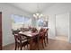 Formal dining room with wood table and chairs, and a chandelier at 2243 Montbrook Pl, The Villages, FL 32162