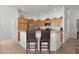 Open kitchen with breakfast bar and stainless steel appliances at 2243 Montbrook Pl, The Villages, FL 32162