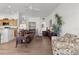 Spacious living room with leather sofas, hardwood floors, and a ceiling fan at 2243 Montbrook Pl, The Villages, FL 32162