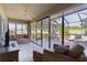 Bright sunroom with comfy seating and view of the patio at 2243 Montbrook Pl, The Villages, FL 32162