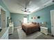 Bright bedroom featuring a king-size bed and window at 22531 5Th St, Howey In The Hills, FL 34737