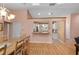 Bright dining area with a view into the kitchen and hardwood flooring at 2709 Tremont Dr, Eustis, FL 32726