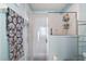 Clean bathroom with a shower/tub combo and updated vanity at 27437 Desert Rose Ct, Leesburg, FL 34748