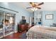 Primary bedroom with private access to a screened patio at 27437 Desert Rose Ct, Leesburg, FL 34748