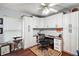 Home office with built-in cabinetry and hardwood floors at 27437 Desert Rose Ct, Leesburg, FL 34748