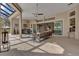 Outdoor kitchen with stainless steel appliances and blue cabinets at 2850 Cedar Grove Loop, The Villages, FL 32163