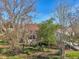 Backyard oasis featuring a screened enclosure and lush landscaping at 2876 Manor Downs, The Villages, FL 32162