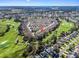 Aerial view showing home's location in community by golf course at 3213 Archer Ave, The Villages, FL 32162