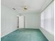Bright bedroom with window and ceiling fan at 5126 County Road 125, Wildwood, FL 34785