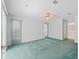 Spacious bedroom with carpet, ceiling fan, and sliding glass doors at 5126 County Road 125, Wildwood, FL 34785