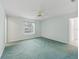 Spacious bedroom featuring a ceiling fan and large window at 5126 County Road 125, Wildwood, FL 34785