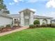 Front entrance with a light green door at 5126 County Road 125, Wildwood, FL 34785
