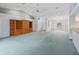 Large living room with a high ceiling and wood cabinet at 5126 County Road 125, Wildwood, FL 34785