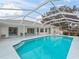 Refreshing screened pool perfect for relaxation at 5126 County Road 125, Wildwood, FL 34785