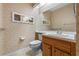 Bathroom features wood vanity, toilet and patterned wallpaper at 636 Mount Homer Rd # 636, Eustis, FL 32726