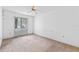 Spacious bedroom with ceiling fan and neutral carpeting at 636 Mount Homer Rd # 636, Eustis, FL 32726