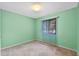 Light green bedroom with neutral carpeting and window coverings at 636 Mount Homer Rd # 636, Eustis, FL 32726