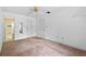 Bright bedroom with carpeting and access to bathroom and closets at 636 Mount Homer Rd # 636, Eustis, FL 32726
