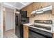 Kitchen features black appliances and wood cabinets at 636 Mount Homer Rd # 636, Eustis, FL 32726