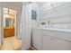 Laundry room with washer, dryer, and shelving at 636 Mount Homer Rd # 636, Eustis, FL 32726