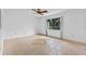 Bright living room with tile floors and ceiling fan at 636 Mount Homer Rd # 636, Eustis, FL 32726