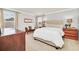 Bright bedroom with a king-size bed and wood furniture at 6607 Crestmont Glen, Windermere, FL 34786