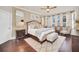 Main bedroom with king-size bed and sitting area at 6607 Crestmont Glen, Windermere, FL 34786