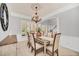 Bright dining room featuring a large table and chandelier at 6607 Crestmont Glen, Windermere, FL 34786