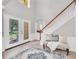 Bright and airy entryway with tile flooring, a bench, and double doors with stained glass at 6607 Crestmont Glen, Windermere, FL 34786