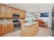 Updated kitchen with wood cabinets and stainless steel appliances at 6607 Crestmont Glen, Windermere, FL 34786