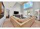 Open living room showcasing a large sectional sofa and high ceilings at 6607 Crestmont Glen, Windermere, FL 34786