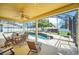 Inviting screened pool area with patio furniture at 6607 Crestmont Glen, Windermere, FL 34786