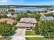 Aerial view of house and neighborhood with lake view at 9249 Ivywood St, Clermont, FL 34711