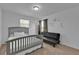 Charming bedroom featuring a bed and a pull-out couch at 9249 Ivywood St, Clermont, FL 34711