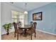 Cozy dining area with a table and four chairs at 9249 Ivywood St, Clermont, FL 34711