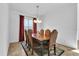 Formal dining room with a large wood table and six chairs at 9249 Ivywood St, Clermont, FL 34711