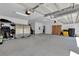 Spacious garage with ample storage and workshop area at 9249 Ivywood St, Clermont, FL 34711